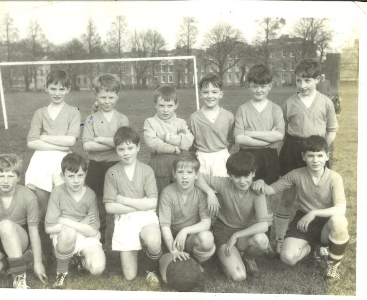 Maloney (standing third from left) as an 11-year-old goalkeeper for St. James Football Club.