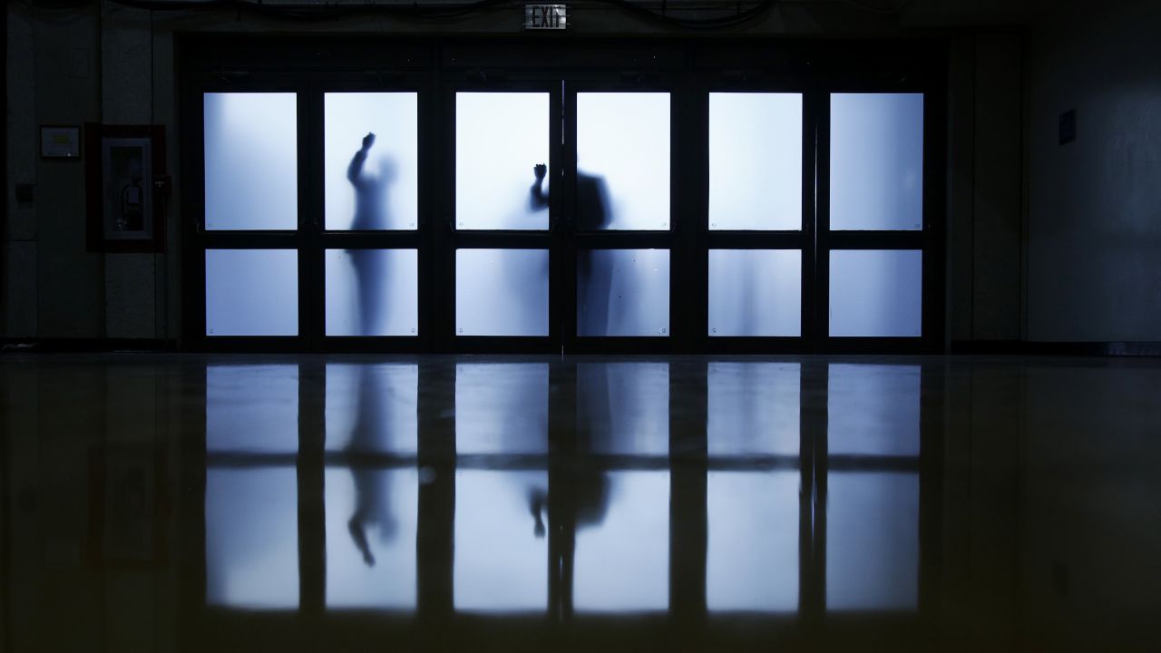 Supporters of Republican presidential candidate Jeb Bush knock on doors of a Miami auditorium to gain entrance to his formal campaign announcement on Monday, June 15. Bush is the son of former President George H.W. Bush and the brother of former President George W. Bush. He was Florida's governor from 1999-2007.