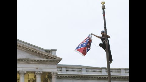 Bree Newsome <a href="http://www.cnn.com/2015/06/27/politics/south-carolina-confederate-flag/" target="_blank">removes the Confederate battle flag</a> from a monument in front of the South Carolina State House on Saturday, June 27. She was charged with defacing a monument, and a new flag went up within about an hour, according to the South Carolina Department of Public Safety. Not long after she was led away in handcuffs, Newsome became an online hero, a trending topic on social media and the subject of an online fundraiser. South Carolina took down the flag on its own in July, <a href="http://www.cnn.com/2015/07/10/us/south-carolina-confederate-battle-flag/" target="_blank">ending a 54-year run</a> on the Capitol grounds.