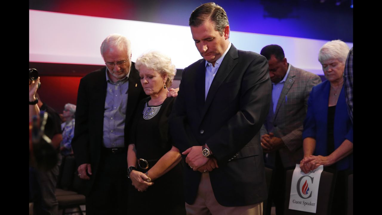 U.S. Sen. Ted Cruz, a Republican presidential candidate from Texas, prays in Des Moines, Iowa, during the "Rally for Religious Liberty" on Friday, August 21. 