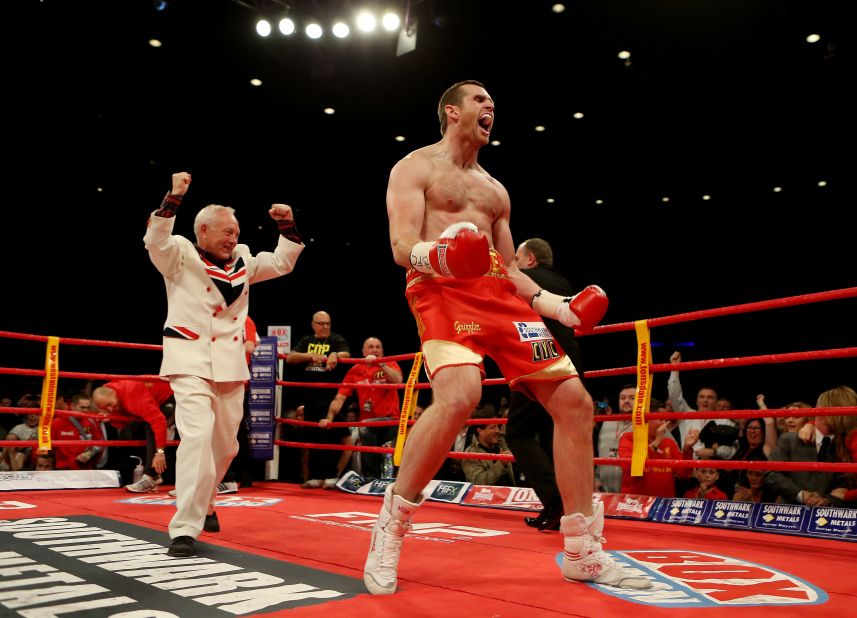 Maloney and boxer David Price celebrate winning against  Audley Harrison after their British and Commonwealth heavyweight championships bout in 2012.