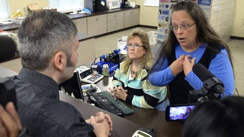 Rowan County Clerk Kim Davis, right, talks with David Moore after she refused him a marriage license in Morehead, Kentucky, on Tuesday, September 1. Davis <a href="http://www.cnn.com/2015/09/14/politics/kim-davis-same-sex-marriage-kentucky/index.html" target="_blank">was eventually jailed</a> for refusing to issue marriage licenses to same-sex couples. She said same-sex marriages violated her Christian beliefs. After her release, she said she would not issue any marriage licenses that go against her religious beliefs. But she left the door open for her deputies to give out marriage licenses to same-sex couples as long as those documents do not have her name or title on them.