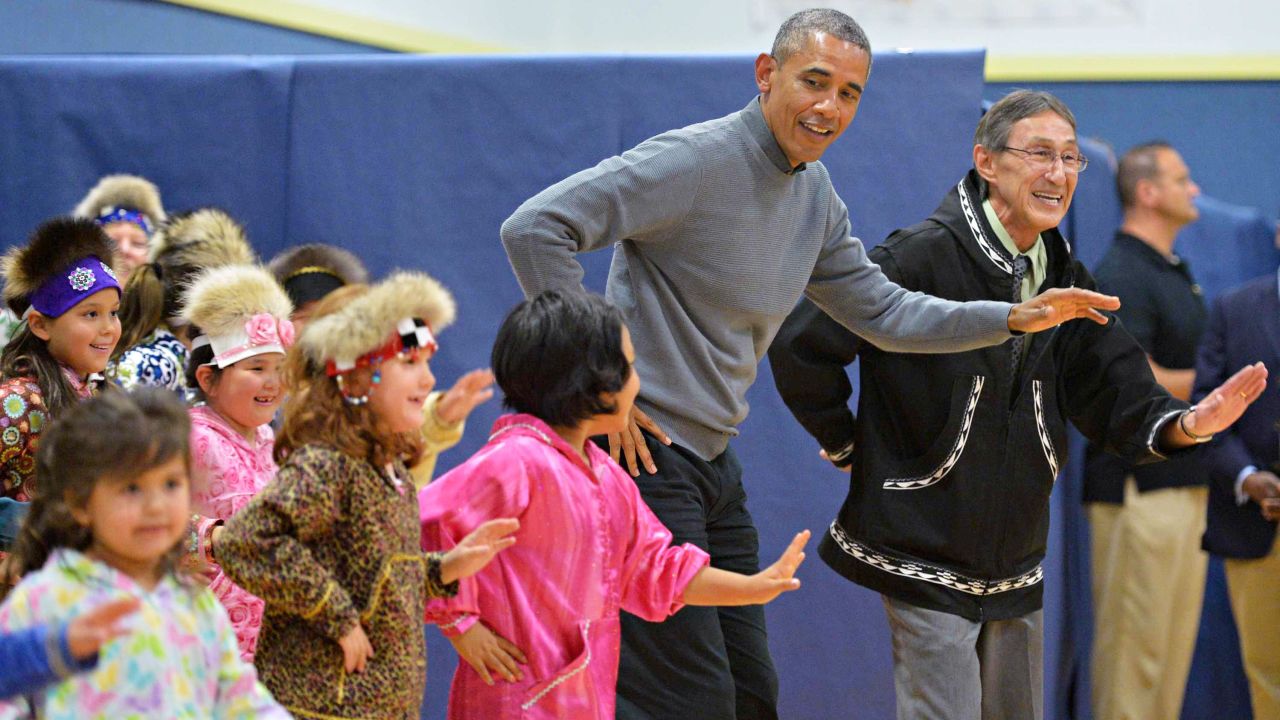 President Obama dances with children after attending a cultural performance in Dillingham, Alaska, on Wednesday, September 2.