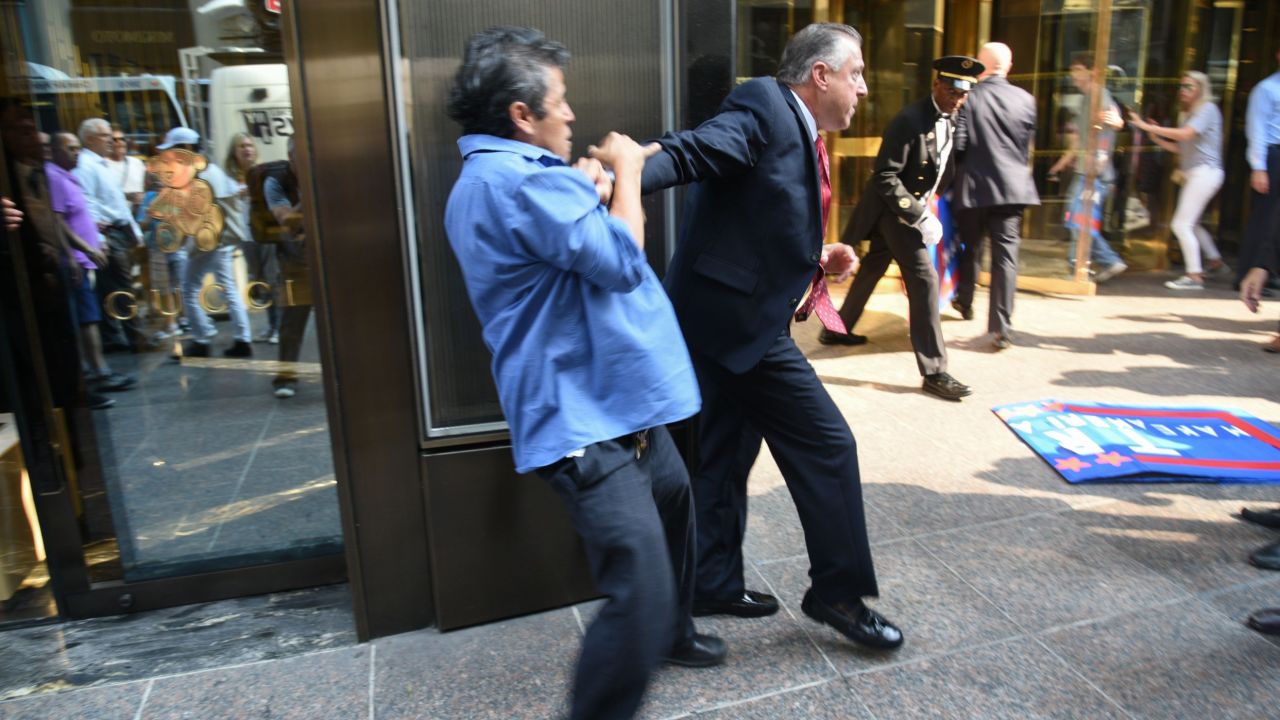 Keith Schiller, Donald Trump's director of security and longtime bodyguard, holds back demonstrator Efrain Galicia at Trump Tower in New York on Thursday, September 3. Galicia was among five protesters who later <a href="http://www.cnn.com/2015/09/09/politics/donald-trump-protesters-lawsuit/" target="_blank">filed a lawsuit</a> against Schiller, Trump, Trump's campaign and his company. The plaintiffs allege that Trump security officials, namely Schiller, assaulted them as they protested outside of a campaign event.