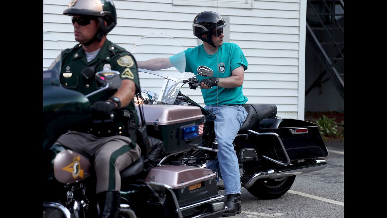 Wisconsin Gov. Scott Walker rides a motorcycle as he arrives at an Elk's Lodge in Salem, New Hampshire, on Monday, September 7. He was a presidential candidate at the time.