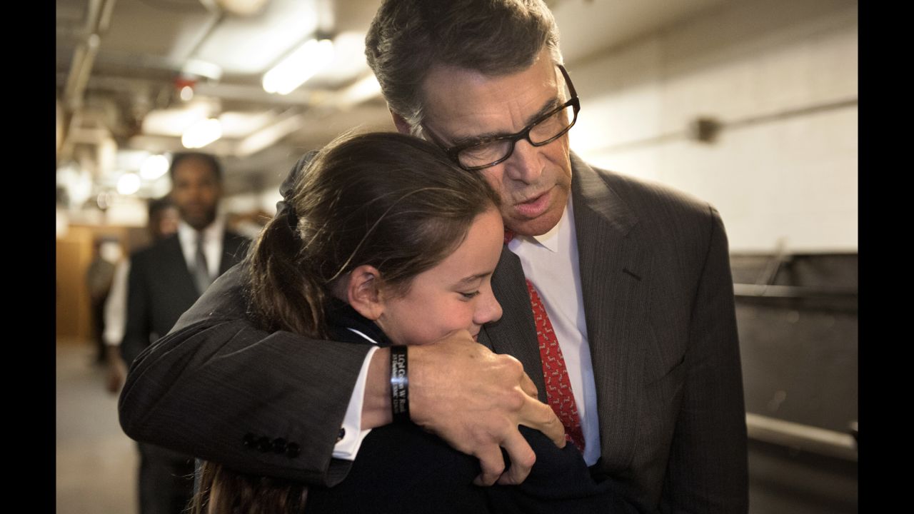 Former Texas Gov. Rick Perry embraces Madeline Martin, daughter of Eagle Forum President Ed Martin, before speaking at the Eagle Council XLIV in St. Louis on Friday, September 11. During his speech, Perry became the first major presidential candidate <a href="http://www.cnn.com/2015/09/11/politics/rick-perry-2016-campaign-suspended/index.html" target="_blank">to drop out of the 2016 race.</a>