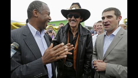 Republican presidential candidate Ben Carson, left, talks with NASCAR legend Richard Petty, center, and Petty's grandson Austin while touring a camp for disabled children Monday, September 28, in Randleman, North Carolina. <a href="http://www.cnn.com/2015/09/29/politics/ben-carson-confederate-flag/" target="_blank">Carson said NASCAR fans should be free to fly the Confederate flag</a> as long as it's on private property. Richard Petty, who partly funds the Victory Junction camp Carson was visiting, called preoccupation with the flag "a passing fancy."