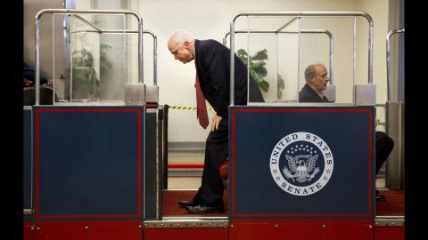 U.S. Sen. John McCain gets on the U.S. Capitol's subway system Wednesday, September 30, in Washington.