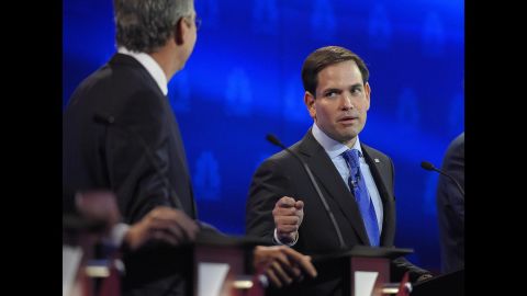 U.S. Sen. Marco Rubio, right, argues with Jeb Bush during a <a href="http://www.cnn.com/2015/10/28/politics/gallery/republican-debates-colorado/index.html" target="_blank">Republican debate</a> in Boulder, Colorado, on Wednesday, October 28. Bush went after Rubio for missing votes in the Senate while running for the White House. "Just resign and let someone else take the job," Bush said. Rubio fired back, saying Bush never took issue with Sen. John McCain missing votes when he was running for President. "The only reason you're doing it now is because we're running for the same position."