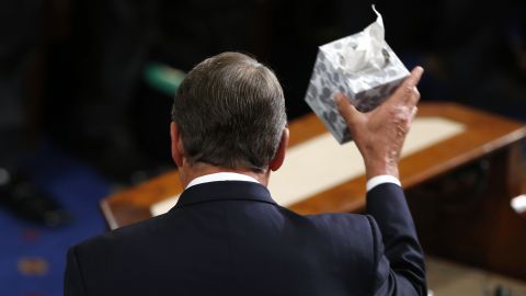 House Speaker John Boehner waves his trademark box of tissues as he addresses colleagues before stepping down on Thursday, October 29.