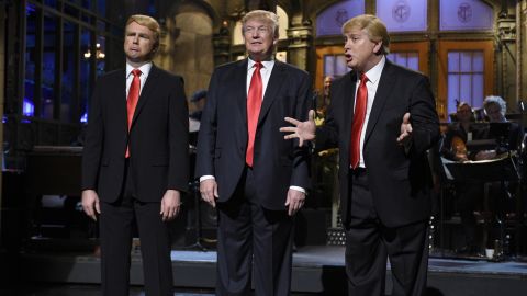 Republican presidential candidate Donald Trump is flanked by impersonators Taran Killam, left, and Darrell Hammond during his <a href="http://money.cnn.com/2015/11/08/media/donald-trump-saturday-night-live-snl-host/" target="_blank">"Saturday Night Live" monologue</a> on November 7.