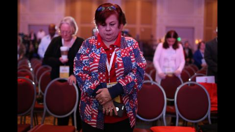 People pray for victims of <a href="http://www.cnn.com/2015/11/13/world/gallery/paris-attacks/index.html" target="_blank">the Paris terrorist attacks</a> while attending the Sunshine Summit, an event in Orlando hosting Republican presidential candidates, on Saturday, November 14.