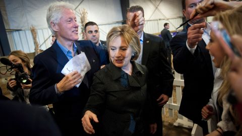 Democratic presidential candidate Hillary Clinton and her husband, former U.S. President Bill Clinton, greet supporters at a barbecue event in Ames, Iowa, on Sunday, November 15.