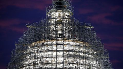 Workers stand on the scaffolding that surrounds the dome of the U.S. Capitol building on Tuesday, November 17. The dome is being renovated.