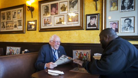 U.S. Sen. Bernie Sanders sits at an Atlanta cafe with rapper Killer Mike on Monday, November 23. The rapper introduced Sanders at a campaign event later in the evening.