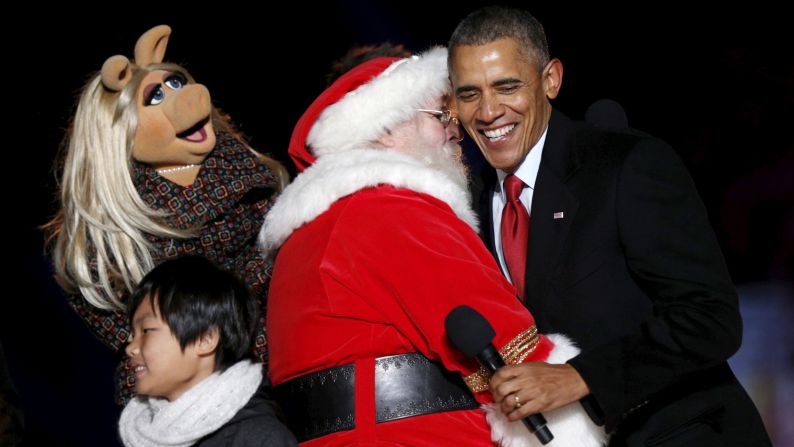 President Obama hugs Santa Claus near Muppets character Miss Piggy during the National Christmas Tree Lighting in Washington on Thursday, December 3.
