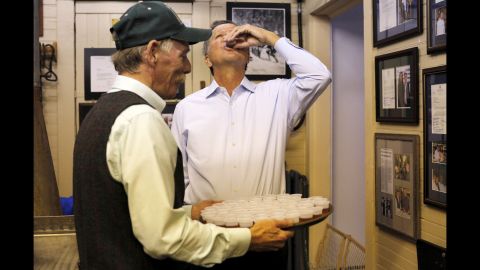 Ohio Gov. John Kasich, a Republican running for President, tastes maple syrup offered to him at a general store in North Woodstock, New Hampshire, on Wednesday, October 14.