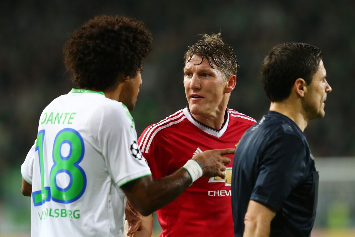 Dante of Wolfsburg and Bastian Schweinsteiger of Manchester United exchange words during the match. Schweinsteiger had a disappointing game and was substituted.  