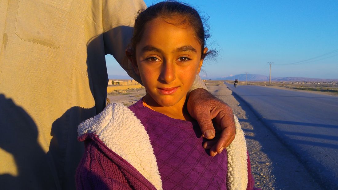 A young resident of Al-Houl, whose extended family of 40 is hoping to return home. They're staying in other abandoned homes a few kilometers away. Kurdish officials say most of the residents of Al-Houl fled with ISIS.