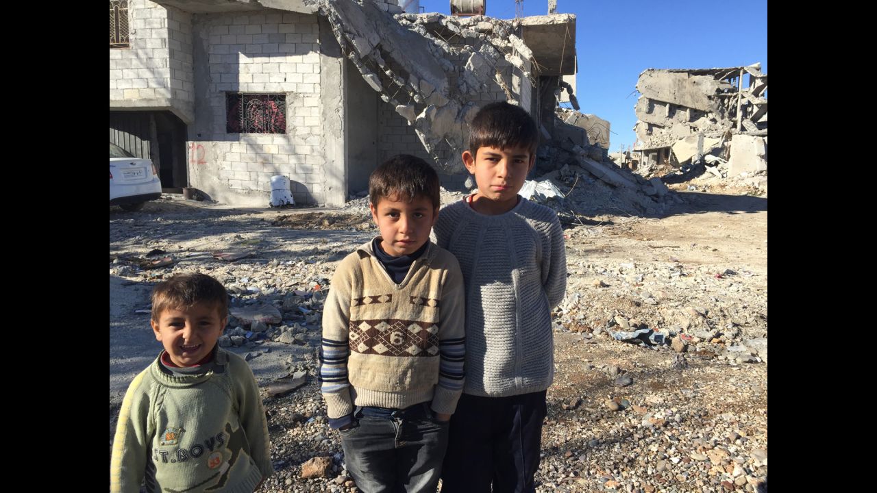 The Muhajar brothers -- Yusif, 3, Mustafa, 8, and Ali, 11 -- in front of their partially destroyed house in Kobani. As someone pointed out to CNN's Ben Wedeman, the expressions from youngest to oldest go from smiling to frowning.