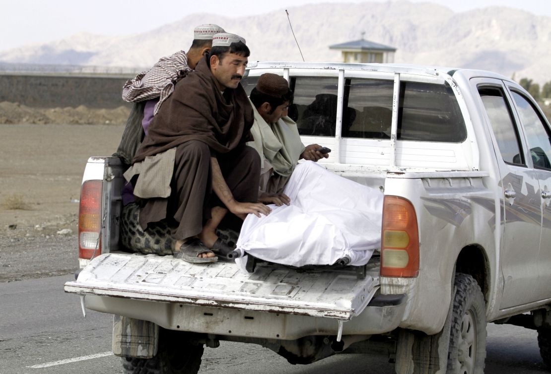 The body of a man killed at Kandahar Airfield is moved.