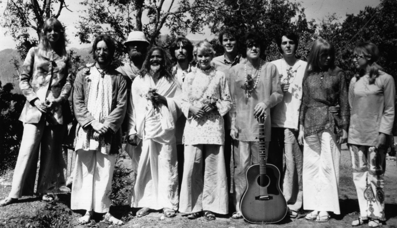 The Beatles weren't the only celebrity devotees who journeyed to India in 1968. John Lennon is second from left, followed by Mike Love from The Beach Boys, Mahareshi Mahesh Yogi, George Harrison, actress Mia Farrow, musician Donovan (fourth from right), Paul McCartney and actress Jane Asher (second from right). 