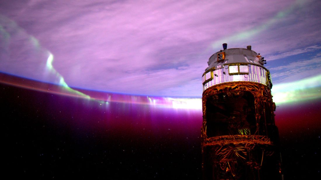 August 27: "Day 154. #Aurora's purple glow adds mystery to the nightscape. Good night from @ISS!"