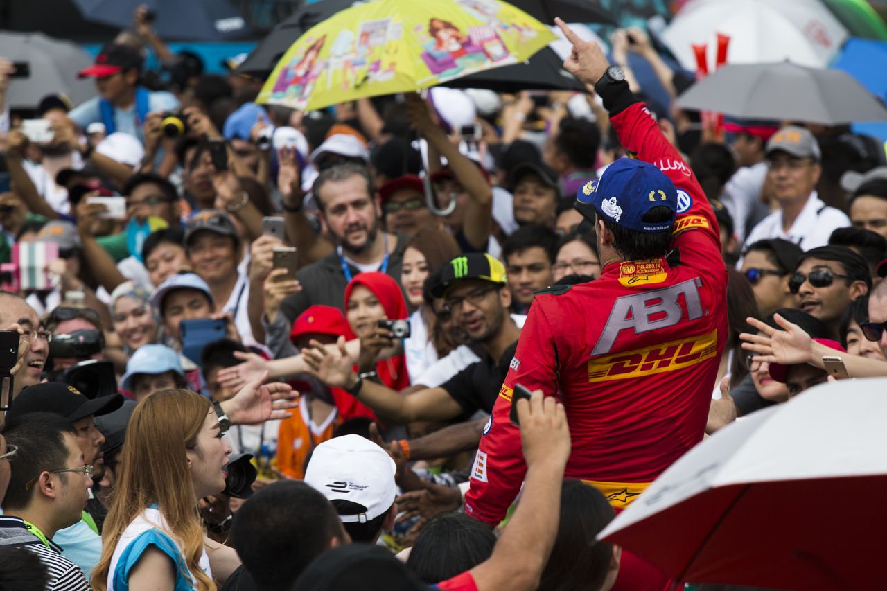 Fans have the chance to get closer to the action in Formula E. Here, Brazil's Di Grassi feels the love after his Malaysia success.