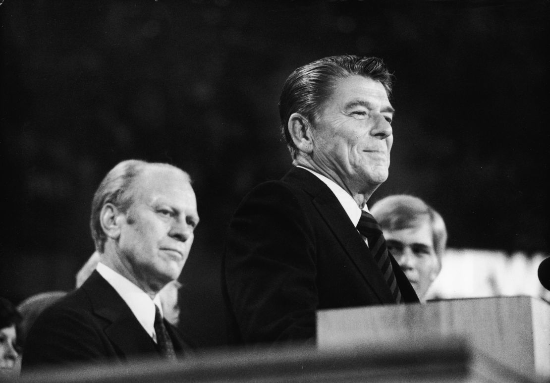 American president Gerald Ford (left) listens as future American president Ronald Reagan (1911 - 2004) delivers a speech during the closing session of the Republican National Convention on August 19, 1976 in Kansas City, Missouri.