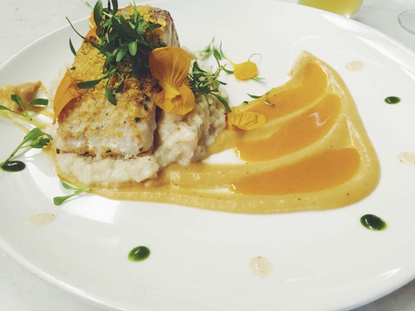 Carmen's plantain-crusted fish of the day served over coconut rice risotto with a baby banana and rum puree is a house favorite. The restaurant's fish comes fresh from Colombia's Pacific coast. Fruits reach the restaurant by way of the Amazon.