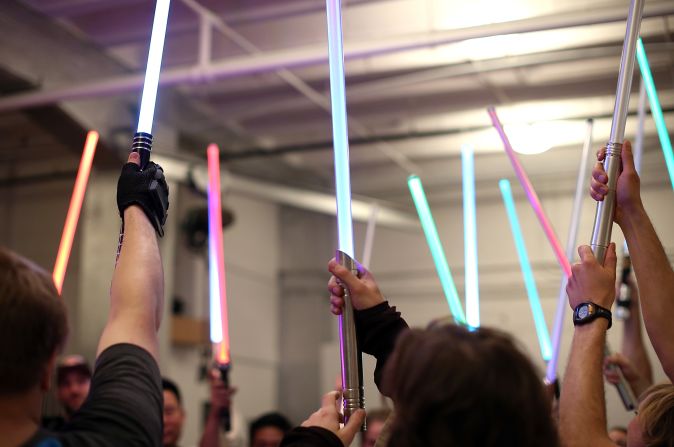 Students hold up their lightsabers during a Golden Gate Knights class in saber choreography in San Francisco, California. 