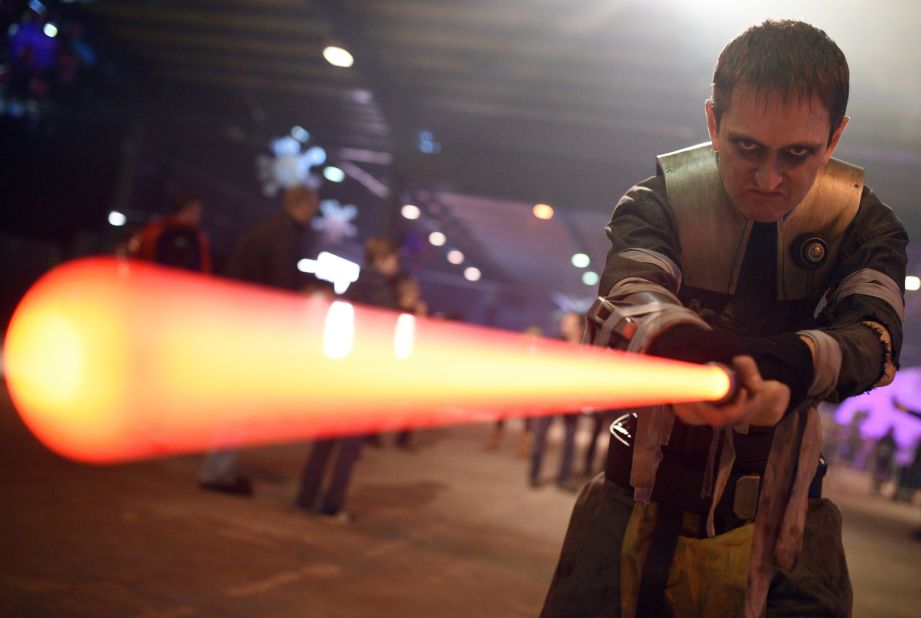 A performer dressed as the Star Wars character Galen Marek, brandishes a lightsaber during the unofficial Star Wars convention, 'For the Love of the Force,' in Manchester, northern England on December 4, 2015. 