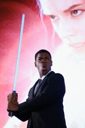 John Boyega poses with a lightsaber at the 'Star Wars: The Force Awakens' fan event at the Roppongi Hills on December 10, 2015 in Tokyo, Japan. 