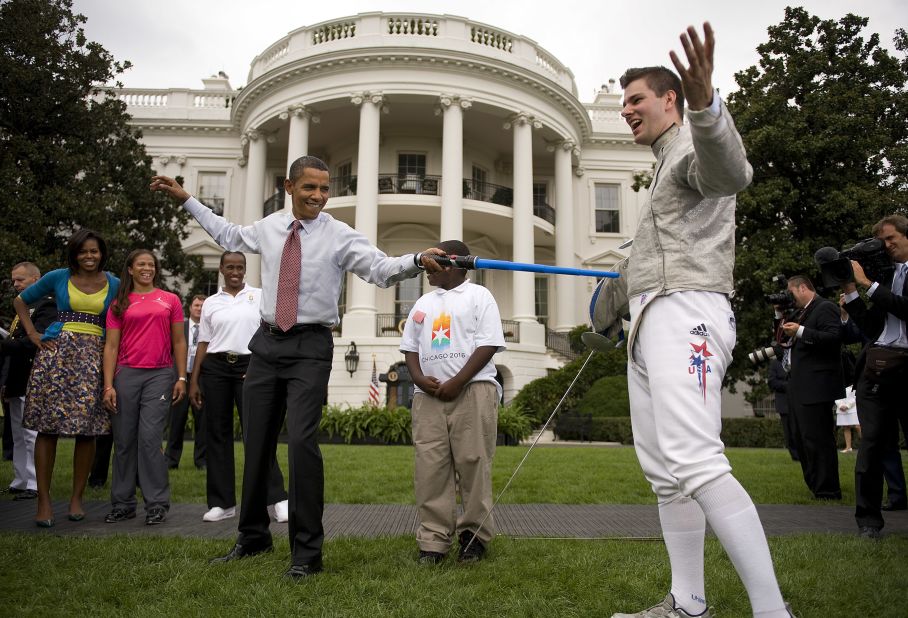 U.S. President Barack Obama fences with Olympic Fencer Tim Morehouse with a lightsaber.