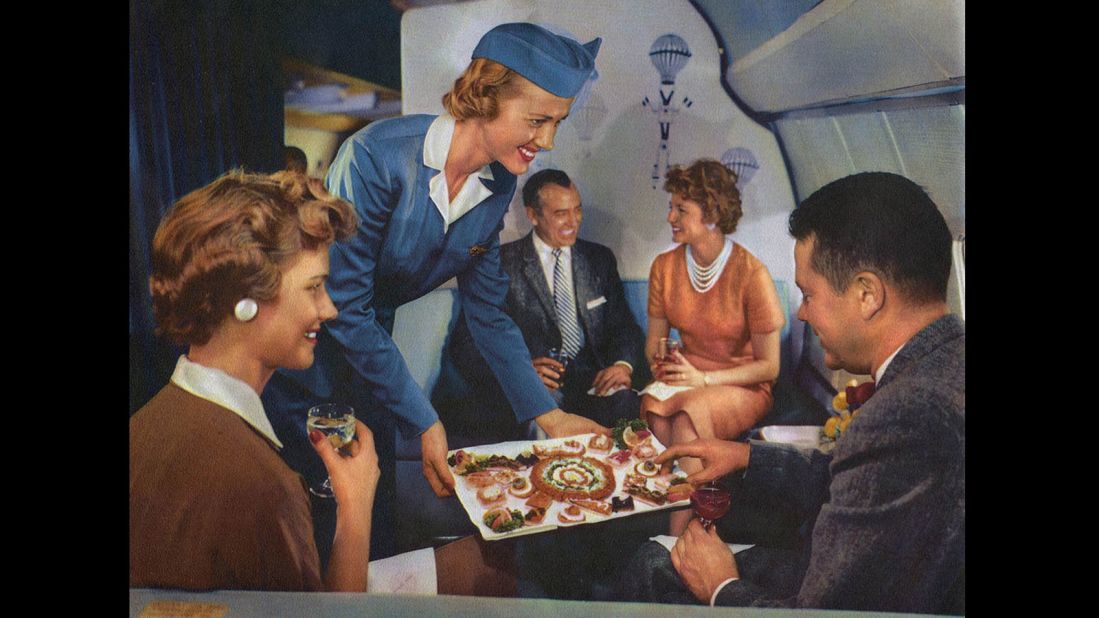<strong>Canapes and cocktails:</strong> In-flight canapes were regularly offered to the "pearl set." Uh-oh, it's the guy in the bow tie again. Let's hope he didn't take as long to choose his food as he did to make a chess move.
