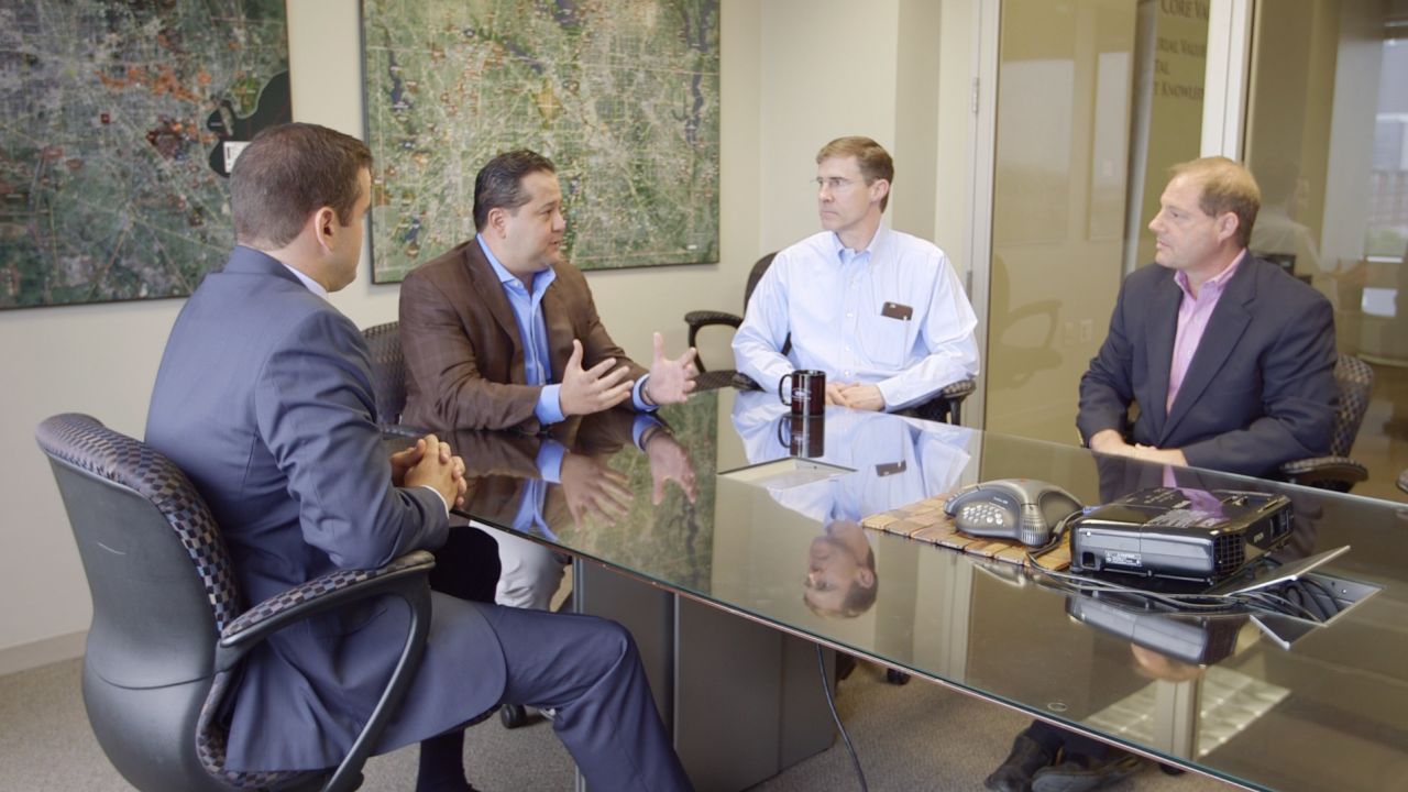 O'Grady, second from right, was drawn to Wellington Realty by friends from church.