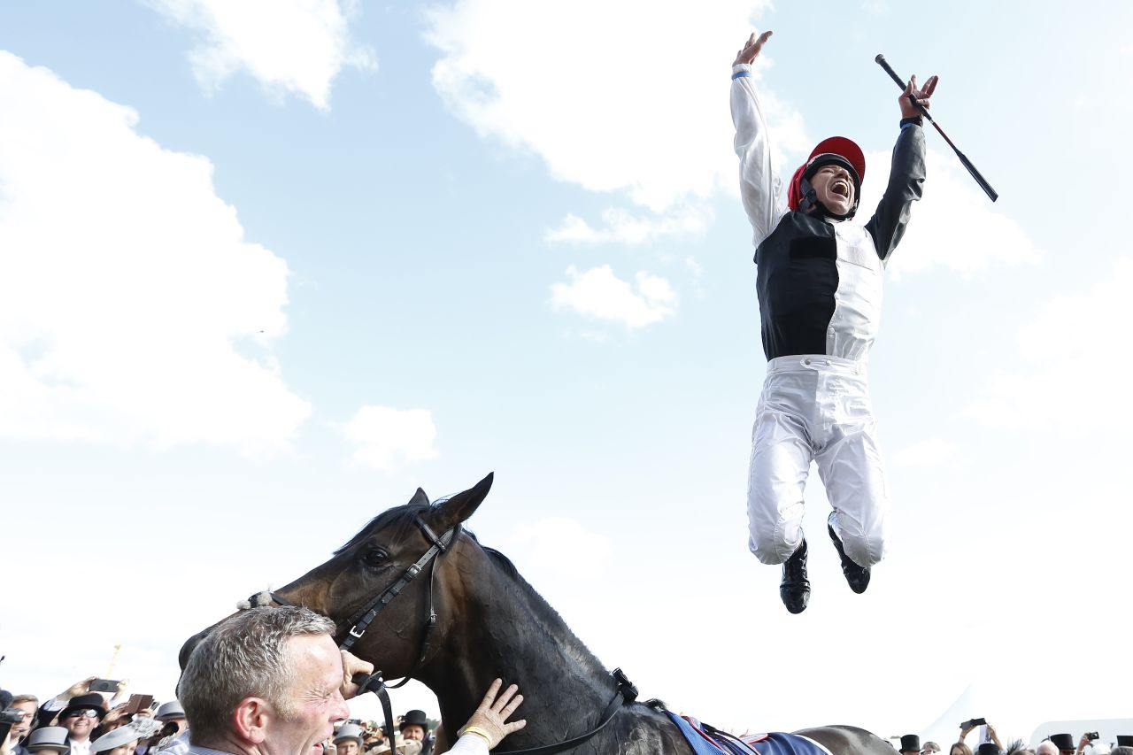 Dettori performs his trademark leap from Golden Horn after winning the Epsom Derby in June.