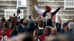 Frankie Dettori atop Golden Horn celebrating what was his fourth win at the Prix De L'Arc De Triomphe -- Europe's richest turf race.
