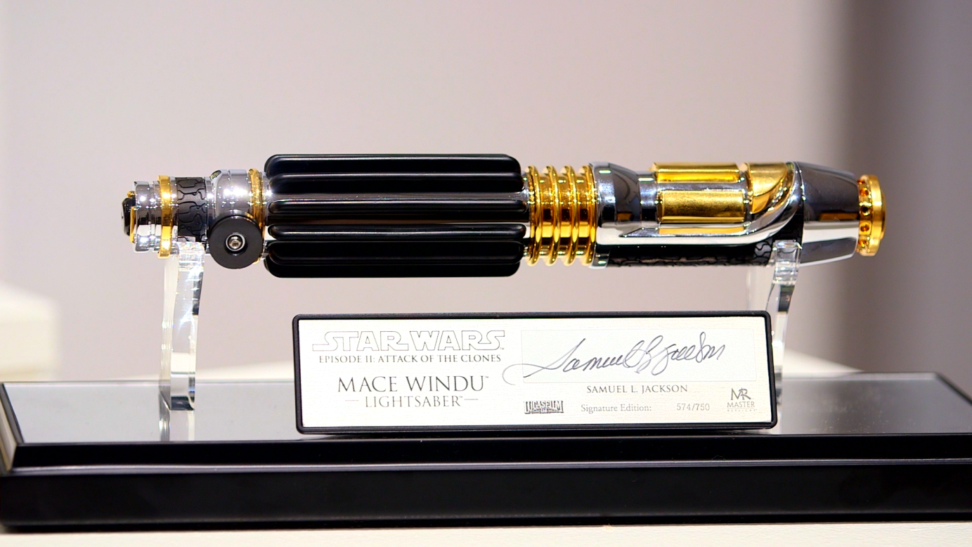 Replica lightsabers are a lucrative business -- especially if they're signed, such as this one. Master Windu's from Episode II had a distinctive purple blade, made at the request of actor Samuel L. Jackson so he would stand out in fight scenes. Many merchandisers had already jumped the dun however: in early figurines from "The Phantom Menace" Windu is accompanied by a blue blade.