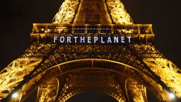 The slogan "FOR THE PLANET" is projected on the Eiffel Tower as part of the COP21, United Nations Climate Change Conference in Paris, France, Friday, Dec. 11, 2015.  (AP Photo/Francois Mori)