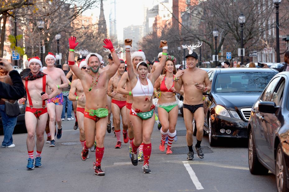 Several hundred runners take part in the annual Boston Santa Speedo Run to raise money for the Play Ball Foundation, supporting athletic programs in Boston schools.