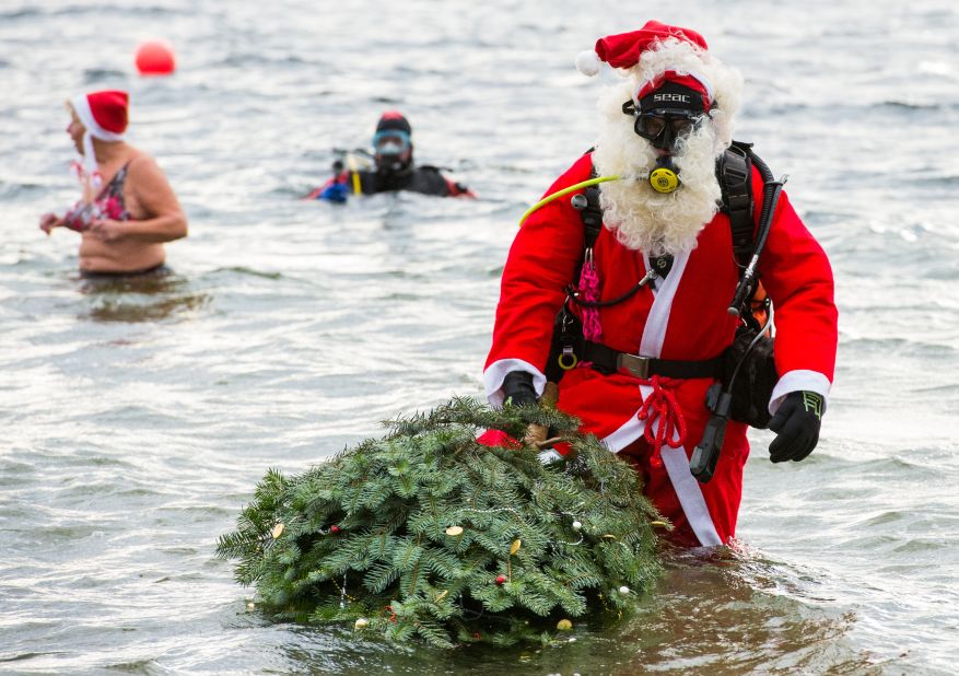 A diver dressed as Santa Claus attends the annual Christmas Diving event at the Helenesee lake near Frankfurt, Germany.