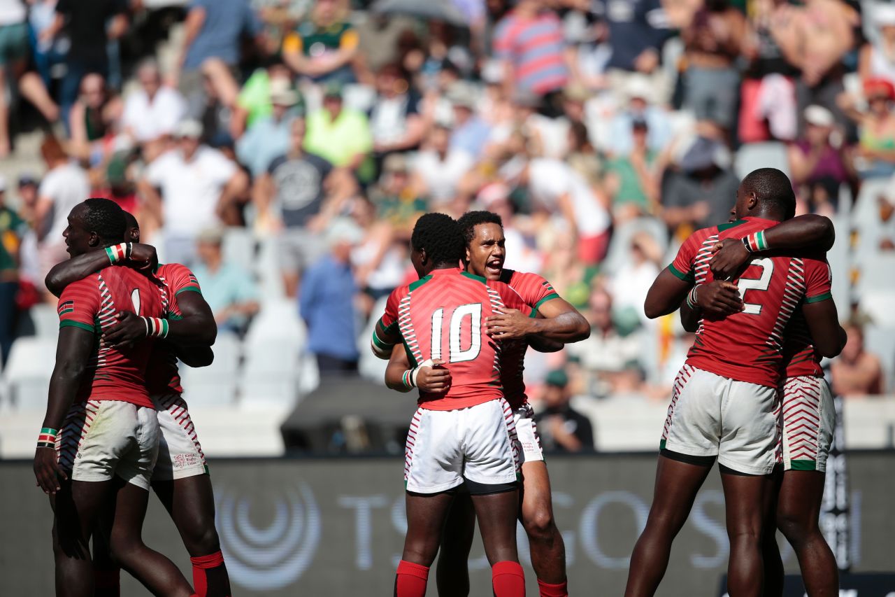 Kenya's rugby players celebrate a famous victory against South Africa on the first day. Kenya eventually took fourth place in the tournament.