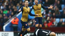 Aaron Ramsey of Arsenal celebrates as he scores his team's second goal against Aston Villa at Villa Park. Arsenal topped the standings after the 2-0 victory.
