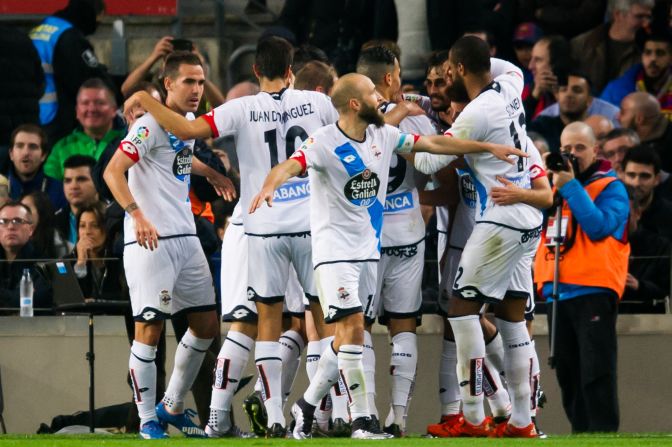Deportivo La Coruna players celebrate after teammate Alex Bergantinos scores his team's second and equalizing goal in the 2-2 draw with Barcelona in the Nou Camp.
