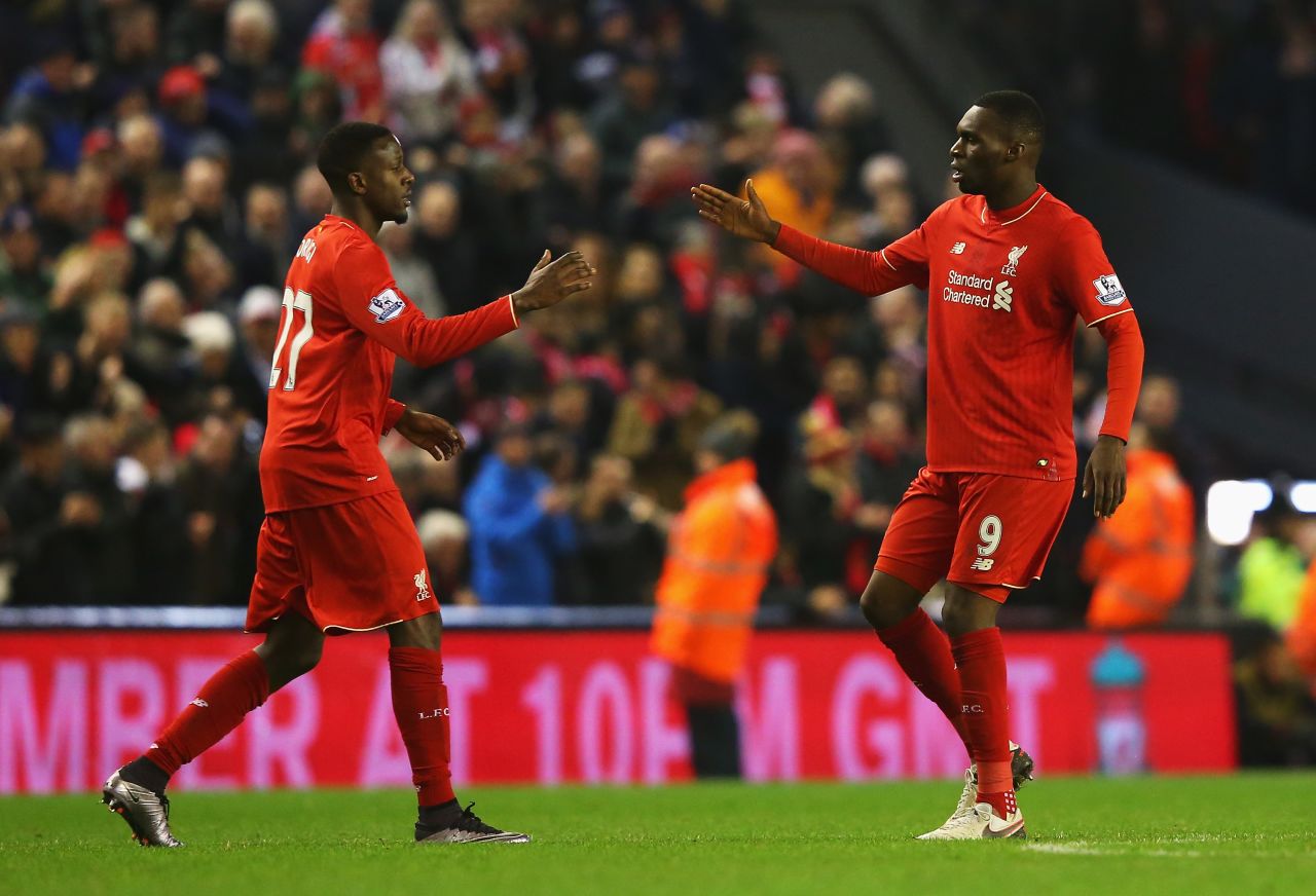 Divock Origi (left) celebrates his late equalizer for Liverpool in the 2-2 home draw with West Brom with teammate Christian Benteke.