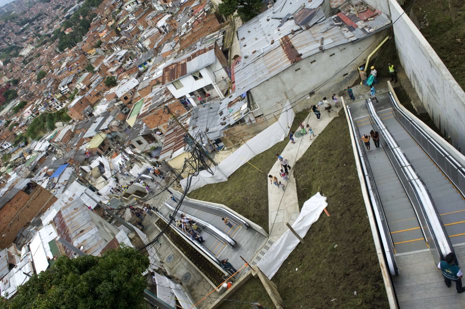 High up on the city's hillside, steep roads made it impossible for vehicles to access Comuna 13. Its 12,000 residents had to hike the equivalent of 28 stories from the city, until a 384-meter escalator was built.