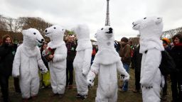 Demonstrators dressed-up as polar bears take part to a climate rally in Paris on Saturday.