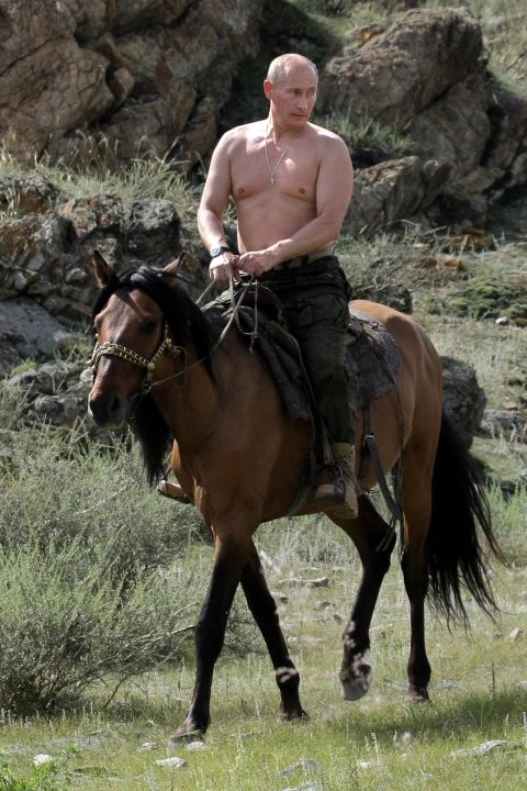 That's when he's not horse riding while on holiday in southern Siberia .