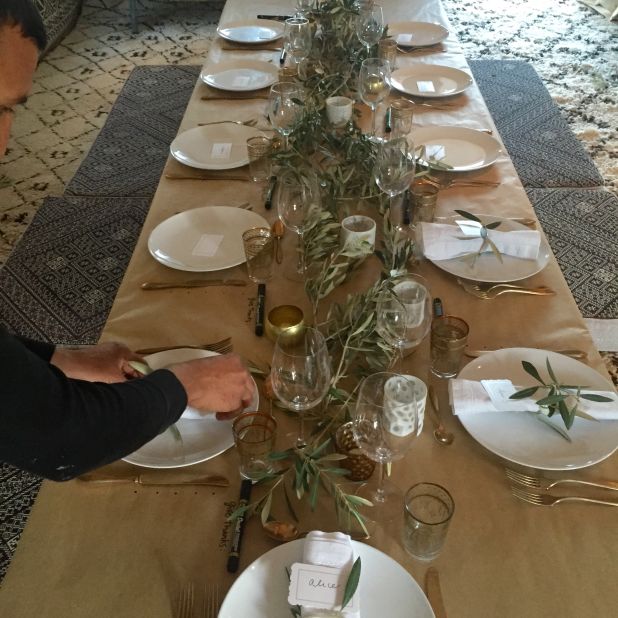 To encourage her guests to give thanks, and write down their thoughts, Montague sets the table with a craft paper tablecloth and provides a pen.<br />The only other decorations are olive branches and candles.  